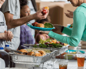 Volunteers handing out food for charity